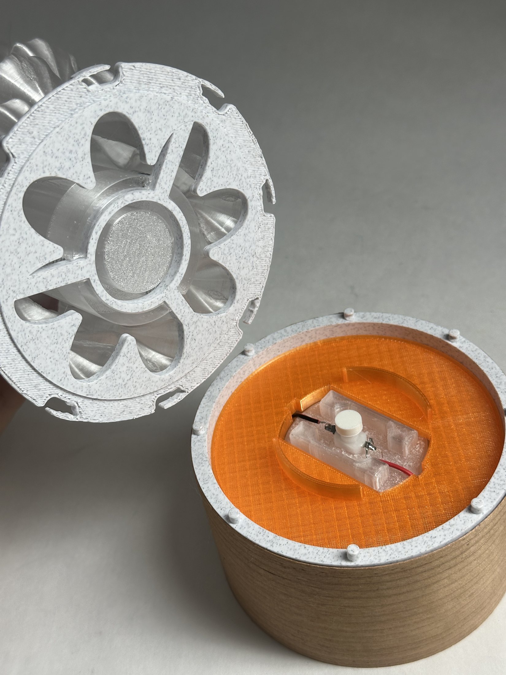 Lamp opened to reveal the push-button light module and orange filter ring