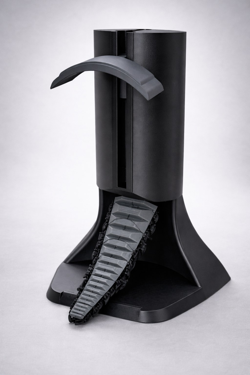 Pangolin Headphone Stand with its articulated tail released downward