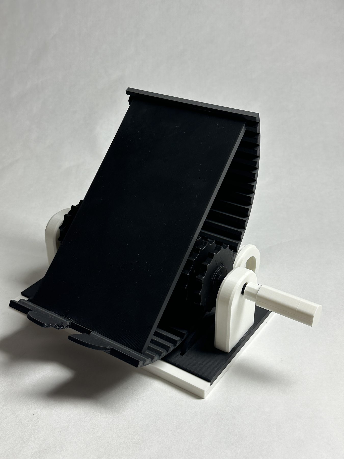 Final black-and-white Rotational Phone Stand shown without a phone