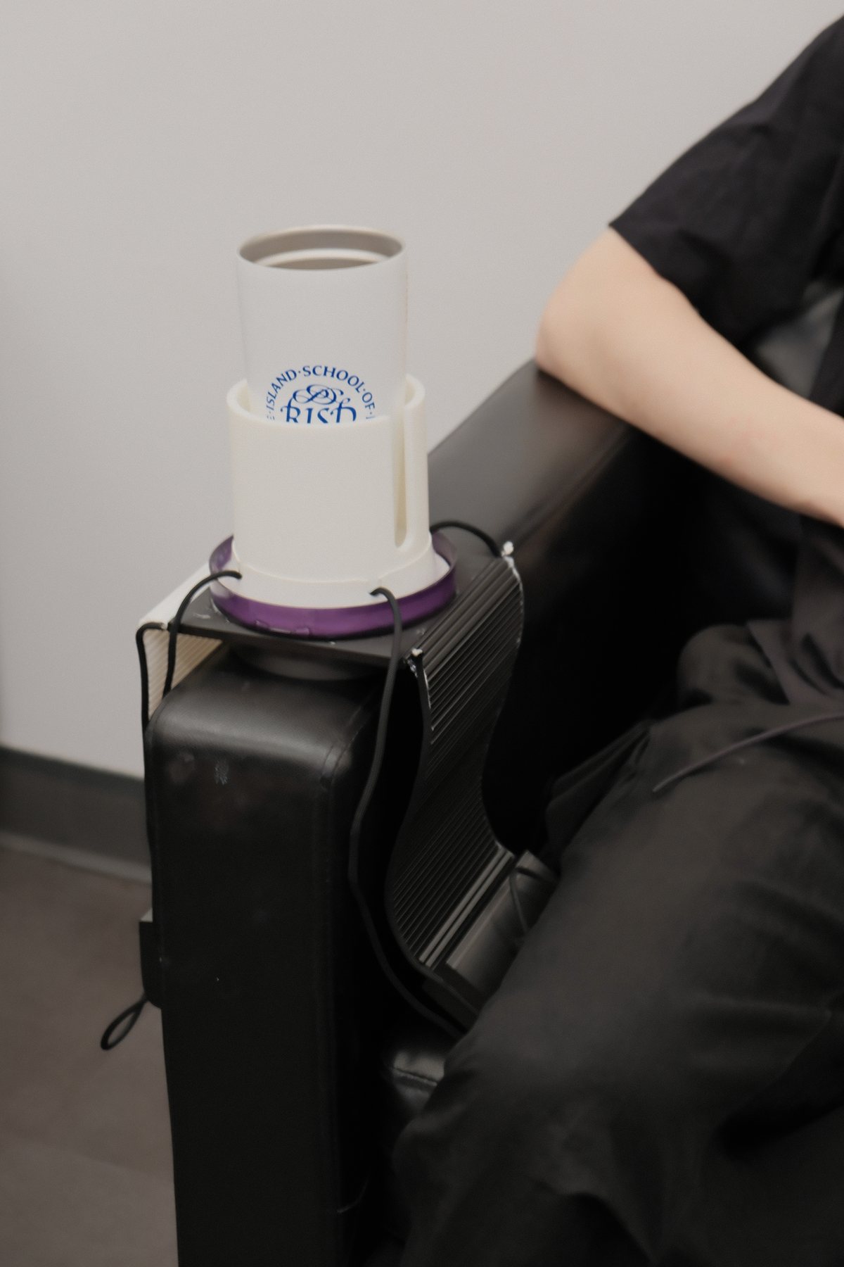 Sofa Balancer accessory system used beside a seated person